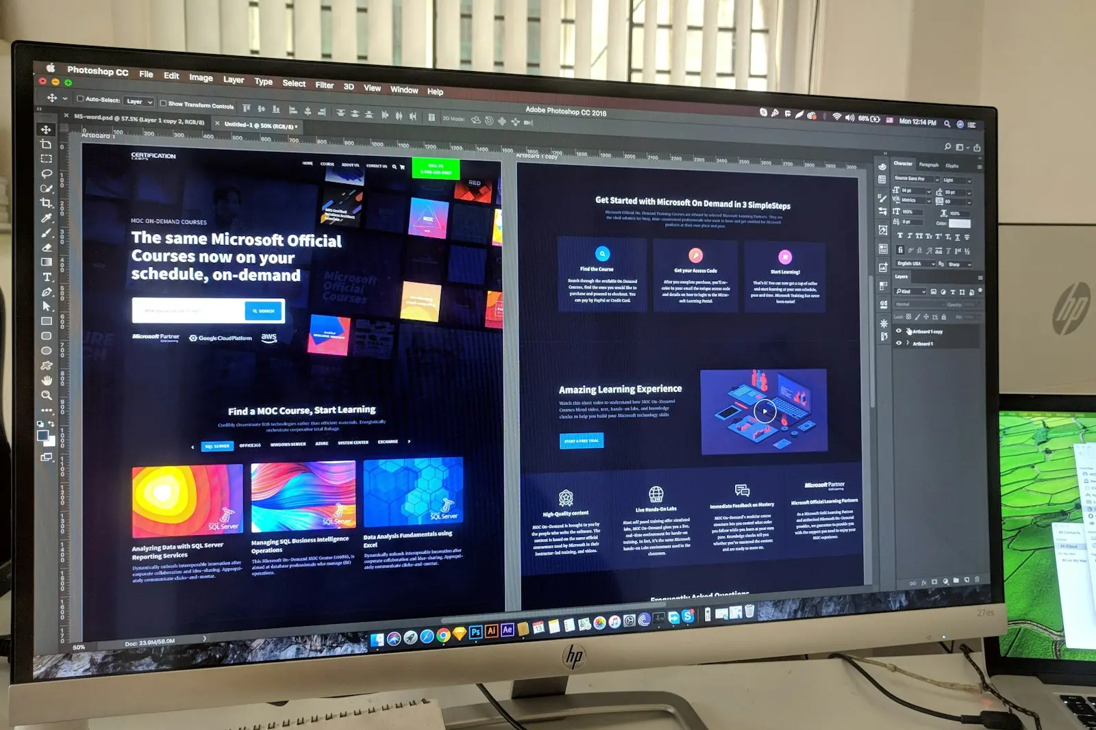 Monitor showing a web page design open in a design program